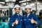 Happy worker team smiling hand show thumb up for good working in factory