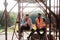 Happy Workers In Construction Site During Lunch Break