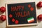 Happy Yalda night. Iranian traditional holiday. Pomegranate inscription on blackboard, flat lay