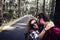 Happy young adult travel couple together with love and friendship enjoy the road and walking in the nature woods forest - selfie