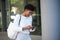 Happy young african woman reading text on cell phone