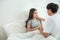 Happy young asian couple encourage and hugging on bed together,Happy and smiling expected mom hope for pregnancy test,Positive