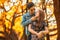 happy young asian couple in love looking and embracing each other . boyfriend holding chin of girlfriend and kiss in autumn