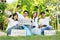 Happy young Asian students diverse volunteers with garbage bags cleaning area in the park, The concept of environmental