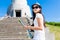 Happy young Asian tourist climbing stairs