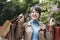 Happy young asian woman carrying shopping bags smiling