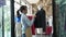 Happy young Asian woman dressmaker fashion designer is checking for completion for a suit and Dress in a showroom. Concept of