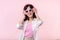 happy young asian woman model with stylish trendy sun glasses enjoy listening music by headphone audio and dancing isolated on