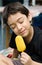 Happy young boy eating a tasty ice cream stick