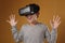 Happy young boy wearing virtual reality VR goggles watching movies or playing video games.  Funny child experiencing 3D gadget