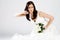 Happy young bride in wedding dress with bouquet