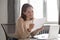 Happy young businesswoman reading great news in paper mail letter