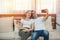 Happy young caucasian couple sit on the couch taking selfie at home in the living room,romance moment of man and woman in leisure