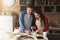 Happy young couple baking in loft kitchen