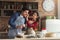 Happy young couple baking in loft kitchen