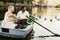 happy young couple in boat on