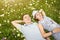 Happy young couple in a chamomile meadow