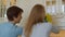 Happy young couple cleaning kitchen