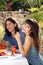 Happy young couple dining outdoors