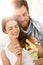 Happy young couple eating icecream on summer beach