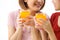 Happy young couple friend beautiful asia women drinking orange juice enjoying fruit refreshment ,Healthy lifestyle concept