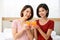 Happy young couple friend beautiful asia women drinking orange juice enjoying fruit refreshment ,Healthy lifestyle concept