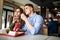 Happy young couple fries during lunchtime in a cafe