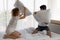 Happy young couple having fun with pillow fight on the bed in bedroom. Enjoying , Love, Relationship