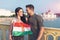 Happy young couple with hungarian flag looking to each other