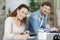 Happy young couple with laptop at home