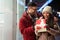 Happy young couple in love celebrating with a gift. People christmas valentine day birthday concept