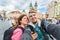 Happy young couple in love takes selfie portrait in Prague, Czech Republic. Pretty tourists make funny photos for travel