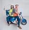 Happy young couple on motorbike. Shopping for the construction and repair of a new home .