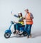 Happy young couple on motorbike. Shopping for the construction and repair of a new home .