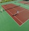 Happy young couple play tennis game outdoor