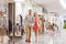 Happy young couple with shopping bags in mall