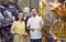 Happy young couple shopping for stainless steel hoses at a modern hardware store