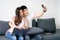 Happy Young Couple Taking Selfie Photo at Home