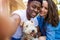 Happy young couple with their pet dog outdoors