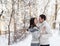 Happy young couple under mistletoe having fun