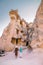 Happy young couple on vacation in Turkey Cappadocia, Rock Formations in Pasabag Monks Valley, Cappadocia, Turkey