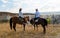 happy young couple on vacation Turkey Kapadokya horse riding in the mountains of Cappadocia Goreme