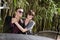 Happy young couple wearing sunglasses on patio