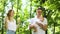 Happy young family with baby girl spending summer time in garden