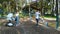 Happy young family having fun with dog Jack Russell Terrier on playground