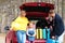 Happy young family near car trunk loaded with suitcases