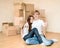 Happy young family showing thumbs up on a background of cardboard