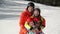 Happy Young Family In Ski Suit With Funny Children In Bright Winter Clothes. Walking Holding Hands In Park. Wonderful