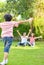 A happy young family spends time playing together