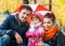 Happy young family under an umbrella